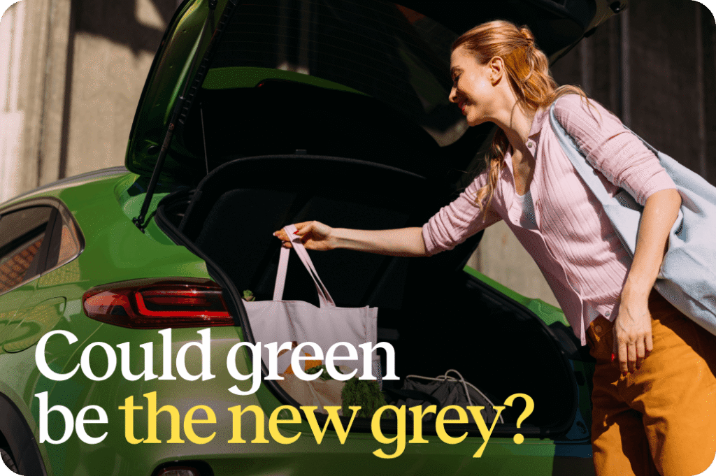 A lady putting a bag into the boot of her green car - titled 'Could green be the new grey?'